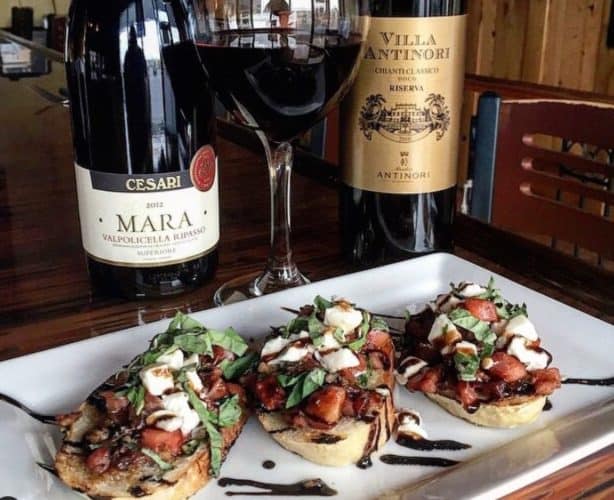 Plate of Bruschetta and Bottle of Red Wine from Ciao Bella in Schererville Indiana