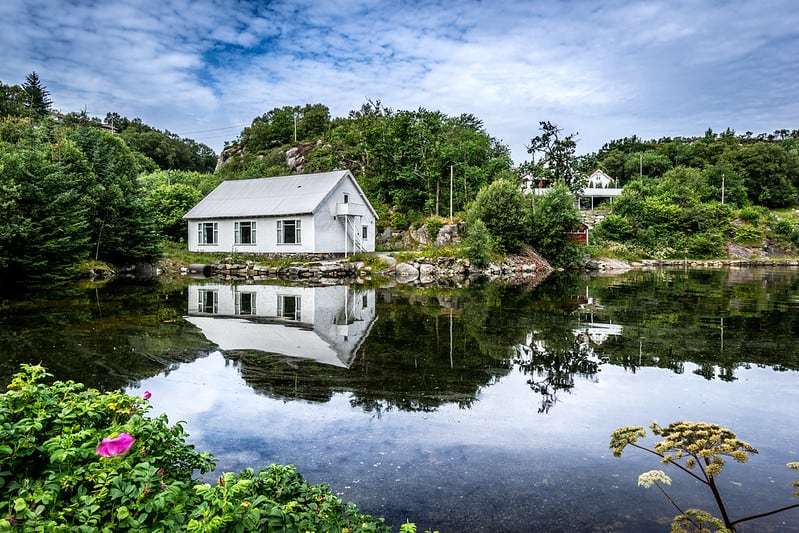 Small Lakehouse Cottage Set Right Next to a Pond in Otherwise Idyllic Pastoral Setting